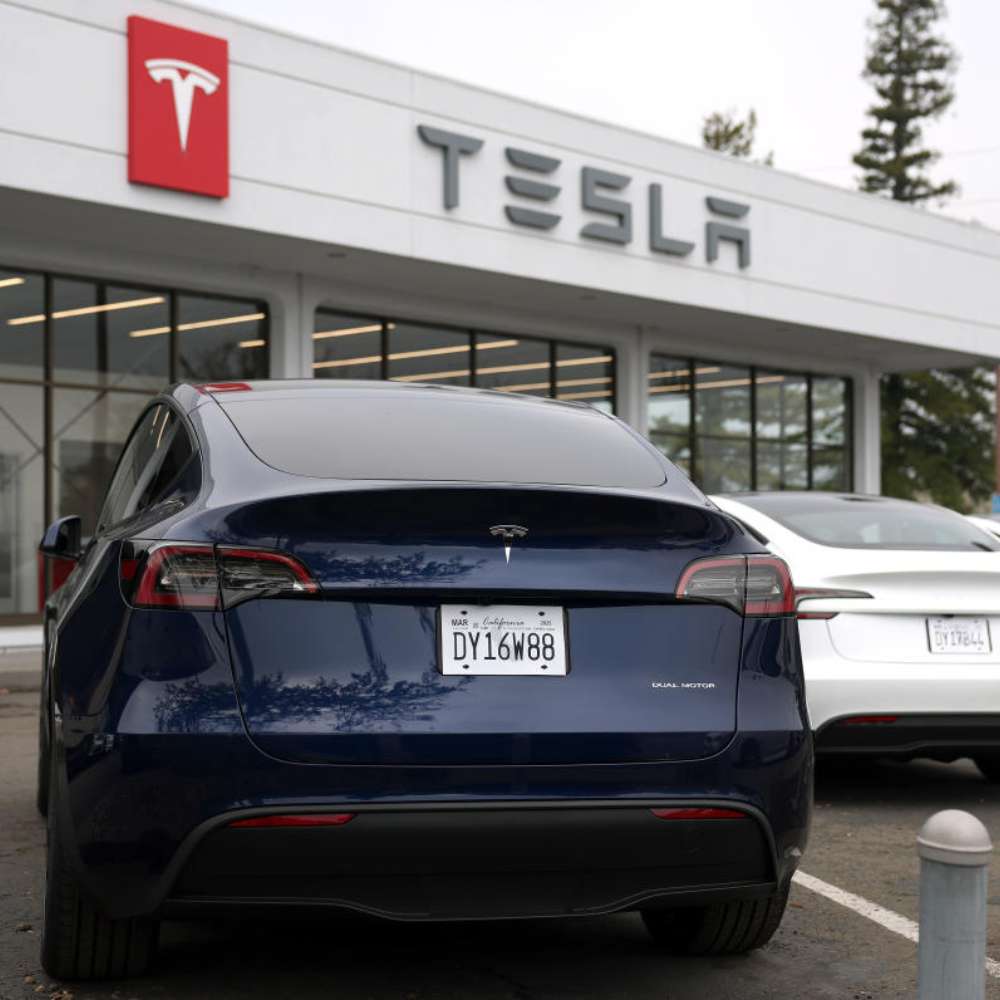 Tesla Shares Slide After First Annual Drop in Deliveries